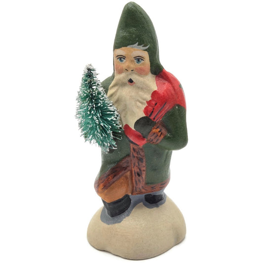 Vaillancourt Small Green Father Christmas Trudging Thru Snow Christmas Figurine